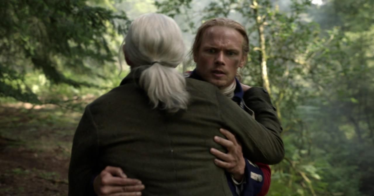 Murtagh embracing someone in Outlander 