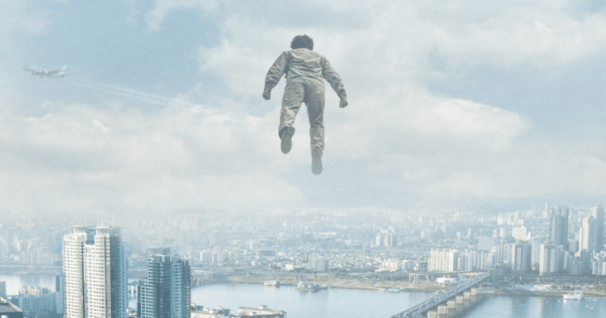 A character rises above the cloudy city in Psychokinesis