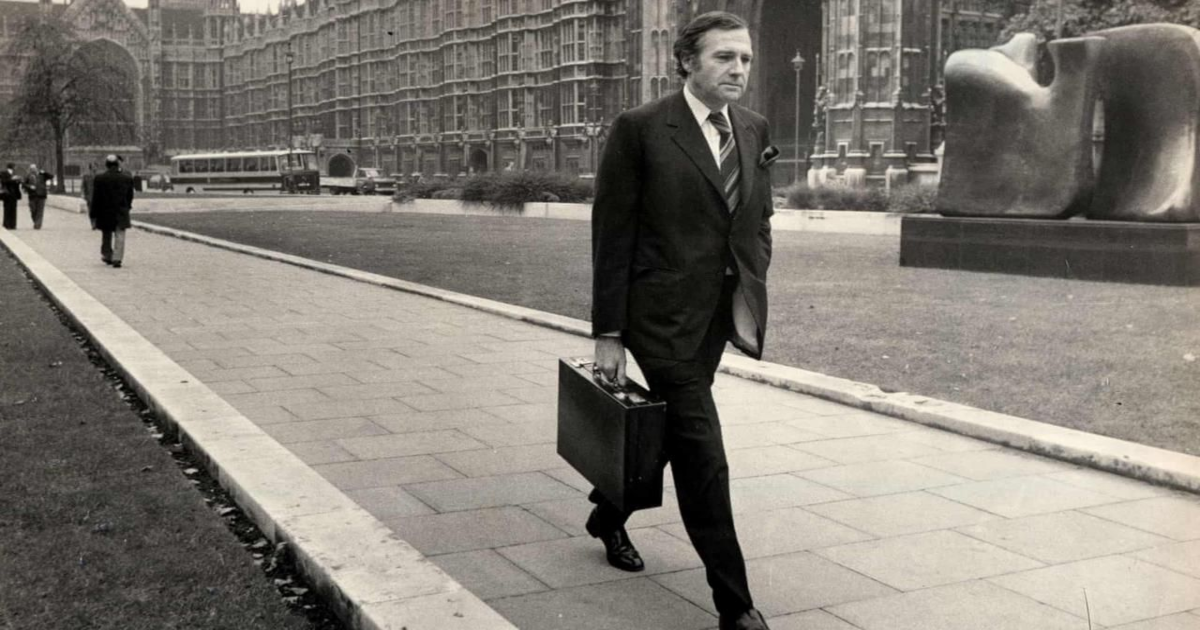 John Stonehouse walking with a briefcase