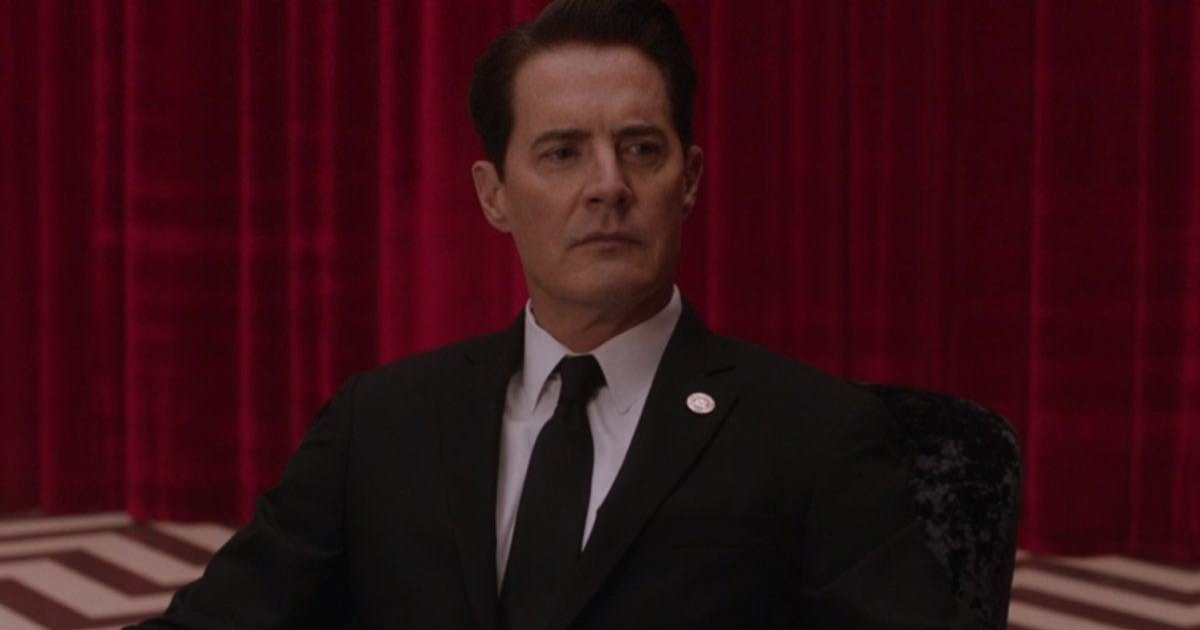 Agent Dale Cooper in his suit sitting in the red room of the lodge in Twin Peaks