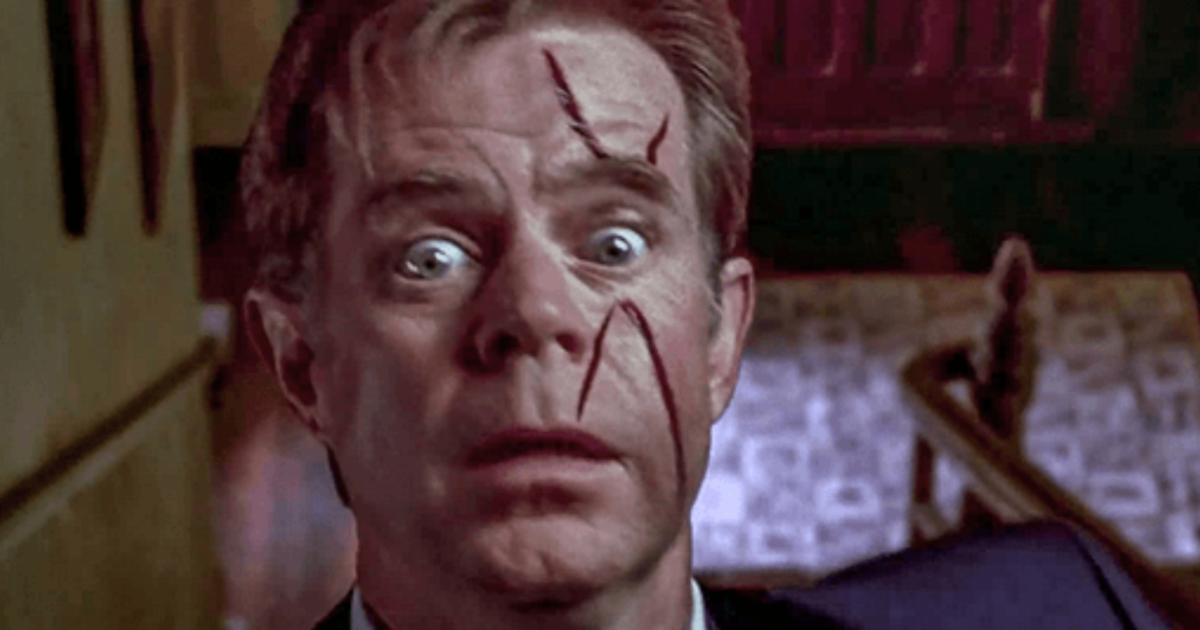 William H. Macy with a bloody face falls down stairs in Psycho
