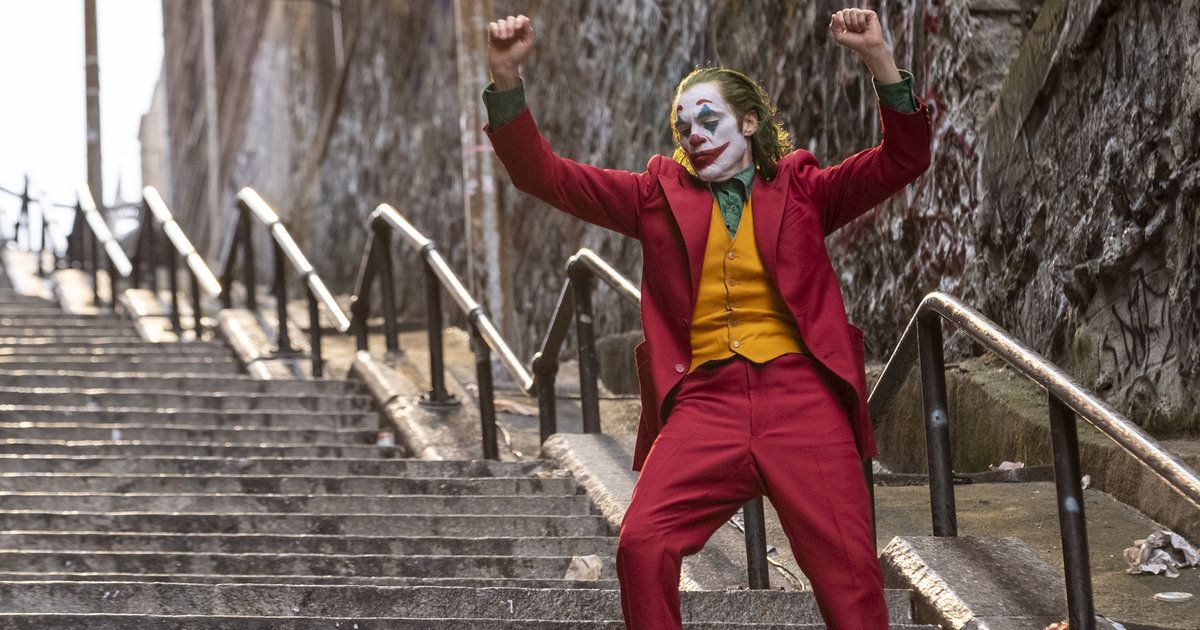 Jaoquin Phoenix as Joker dancing on the stairs