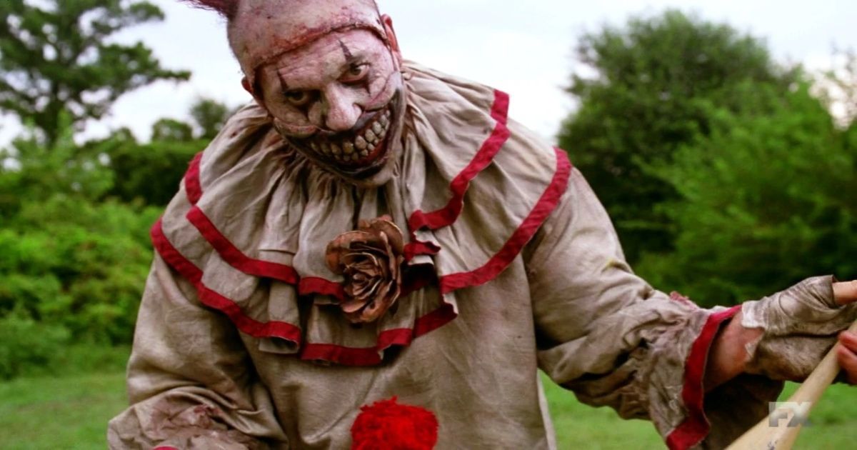 Killer clown looking at camera in American Horror Story: Freak Show