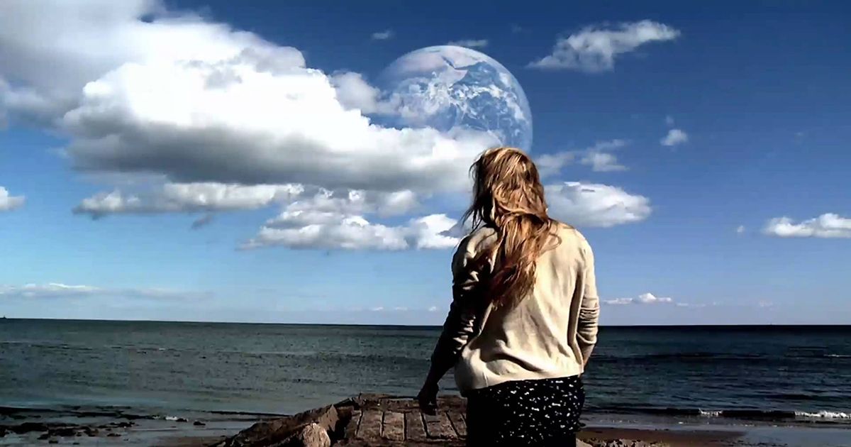  A young woman looks at the Earth in the Sky in Another Earth (2011).