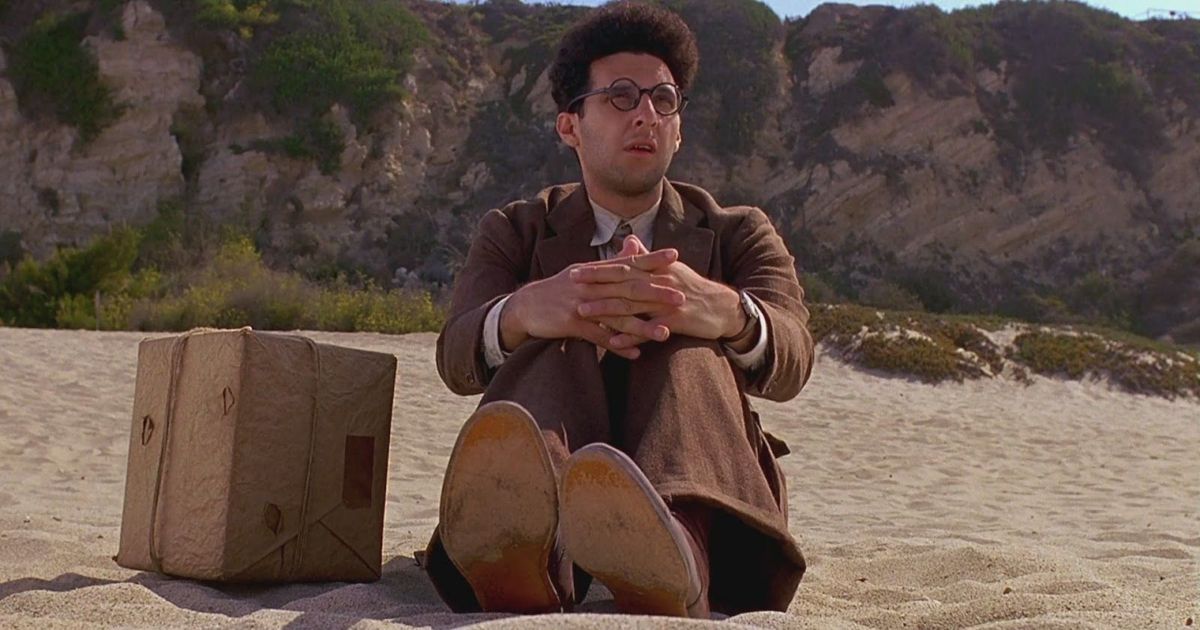 John Turturro na praia de Barton Fink