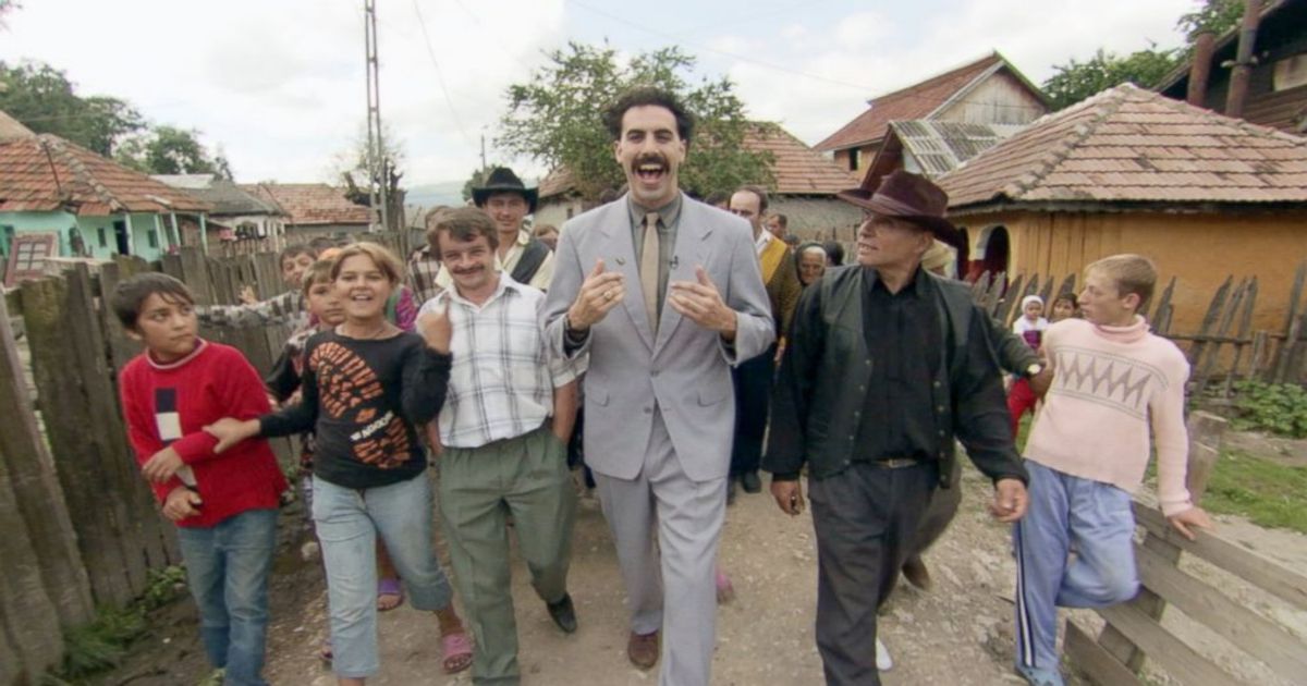 Borat walking through Kazakhstan with people