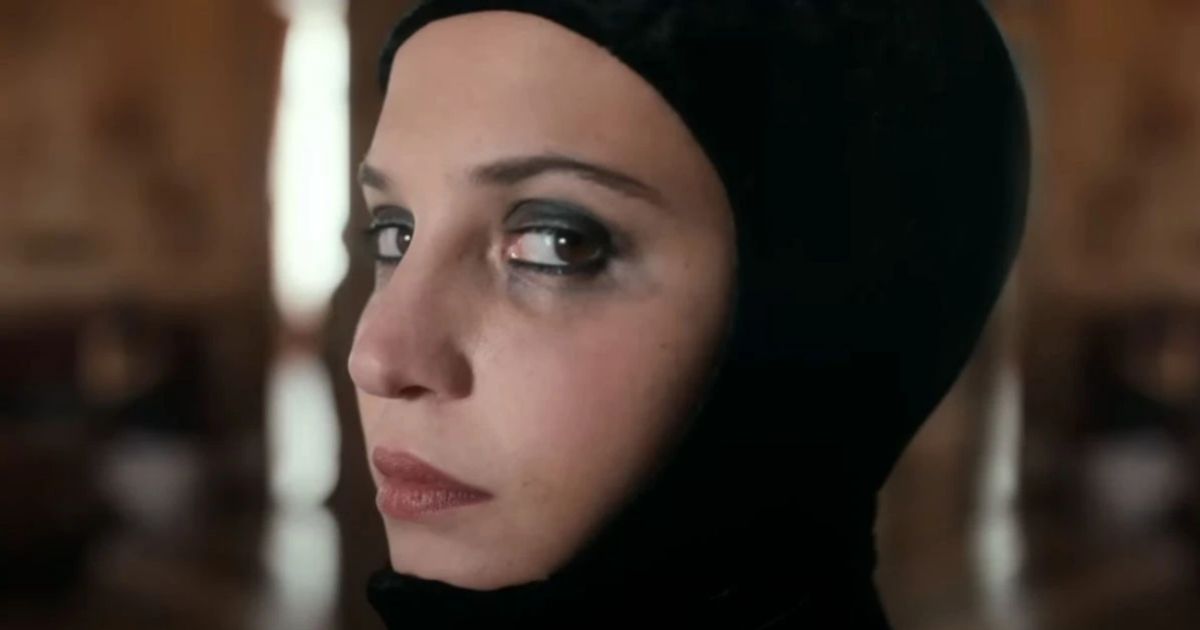Extreme close-up of Alicia Vikander with dark eye makeup in Irma Vep 2022