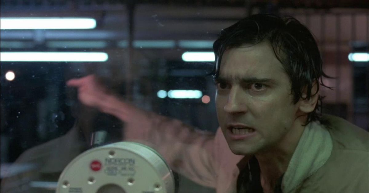 Griffin Dunne soaking wet and pointing in After Hours