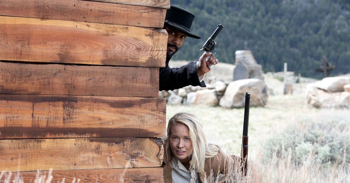 Isaiah Mustafa and Anna Camp have a shootout in Murder at Yellowstone City