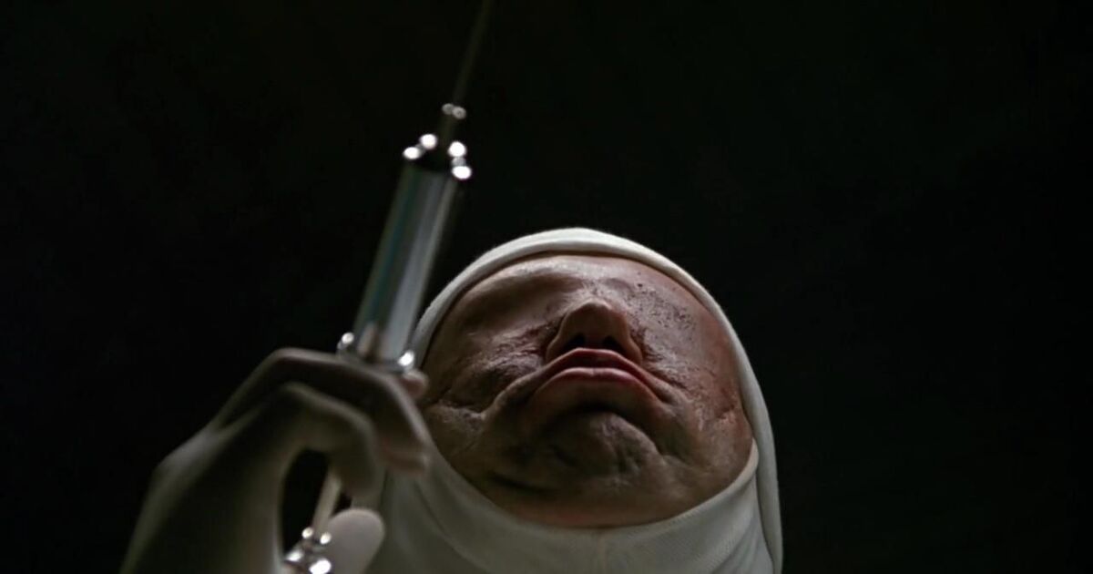 A creepy man with a syringe in Jacob's Ladder from 1990