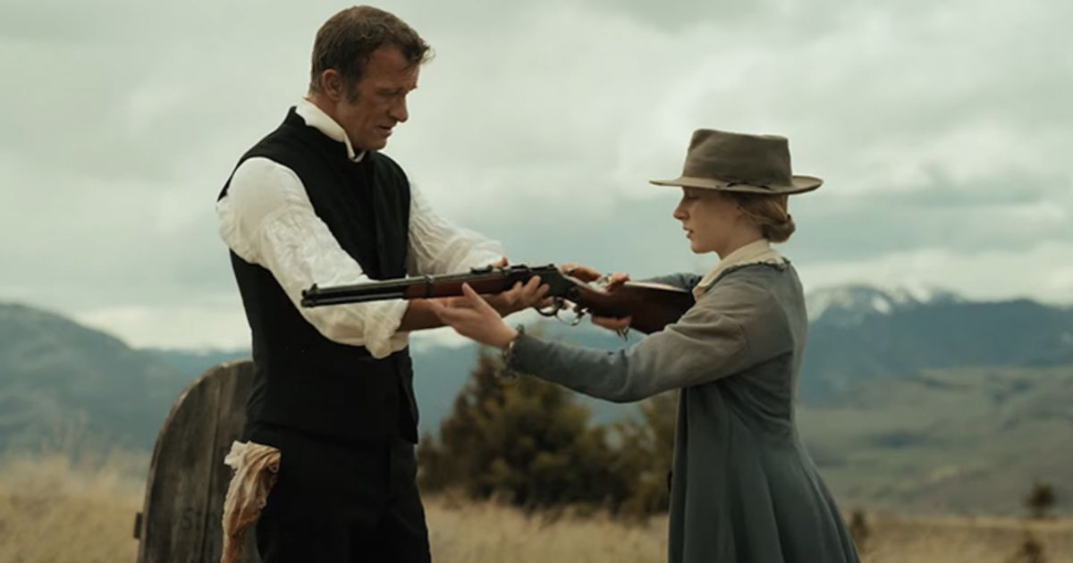 Thomas Jane hands a girl a gun in Murder at Yellowstone City