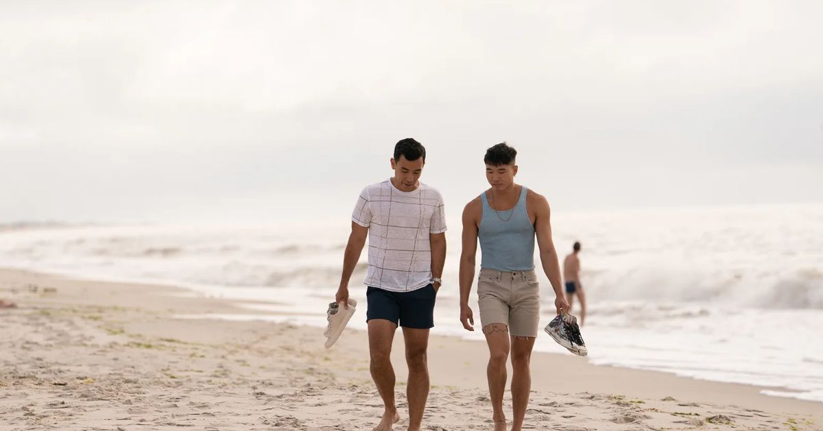 Will and Noah walk on the beach in Fire Island