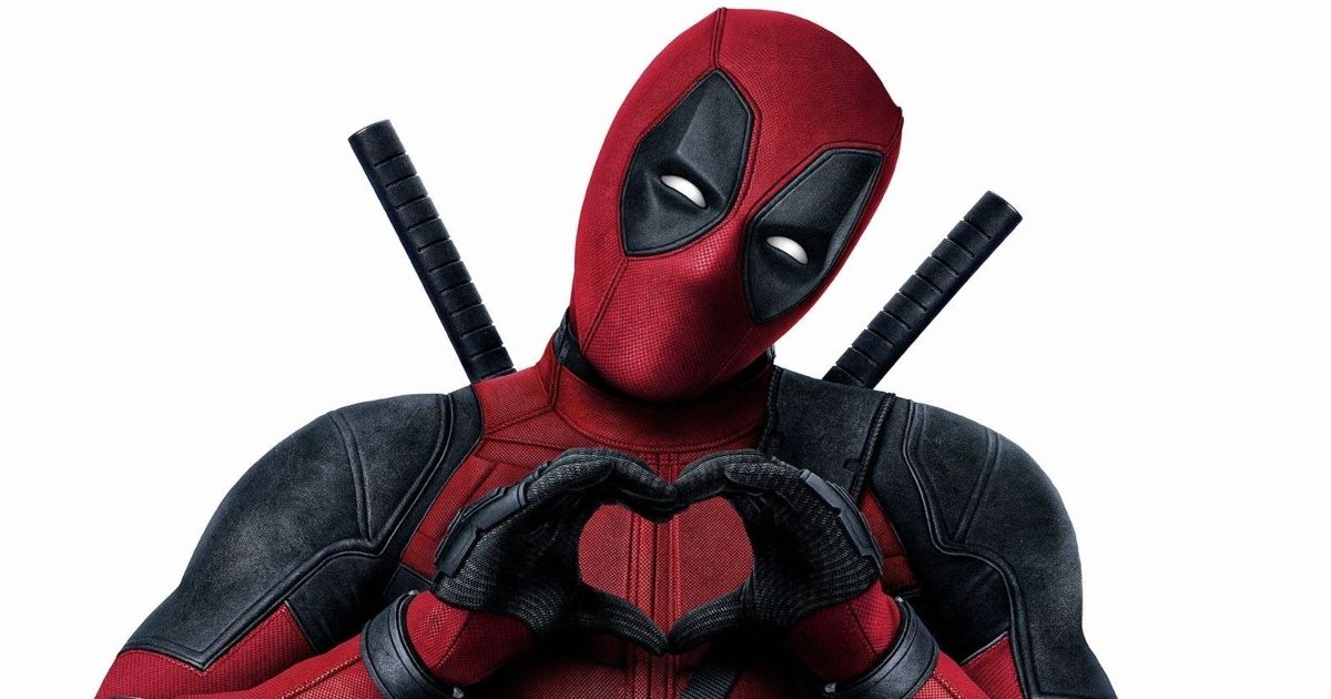 Ryan Reynolds as Deadpool making a heart