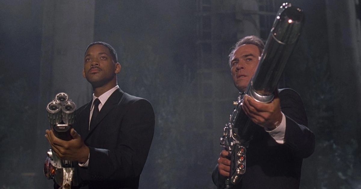 Agents J and K with futuristic guns in Men in Black