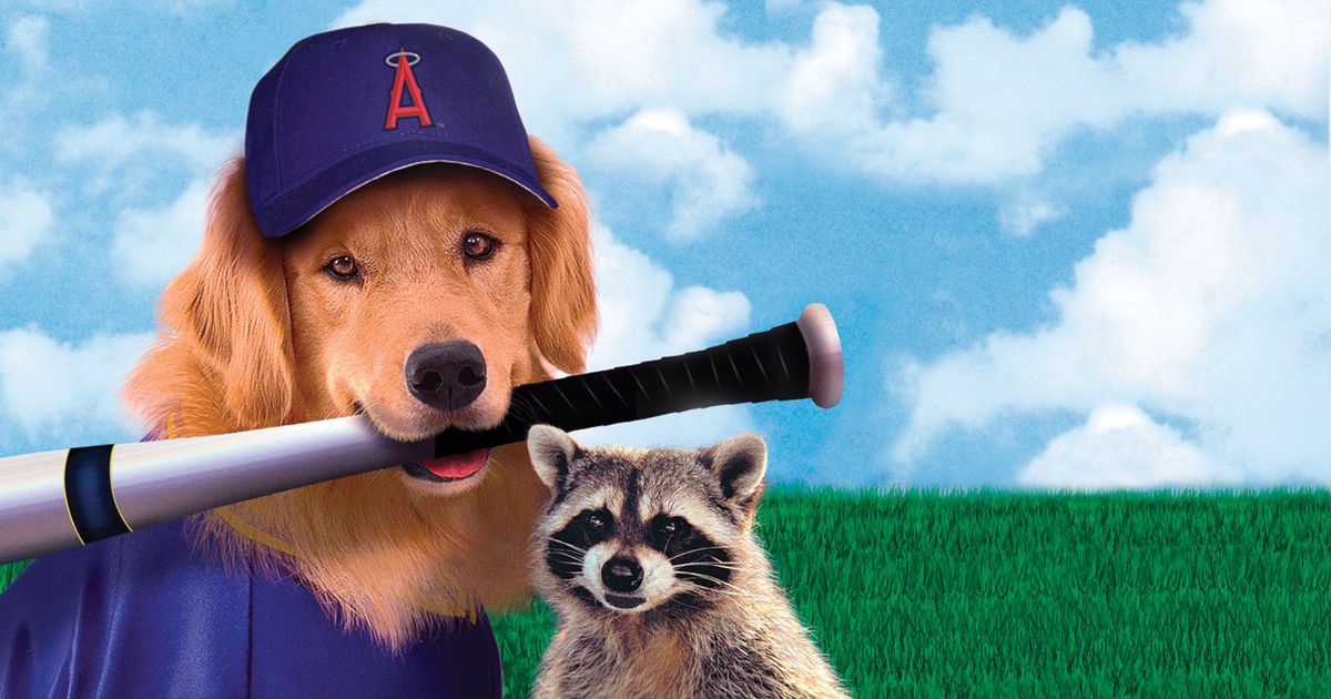 Air Bud holding a baseball bat in his mouth with a raccoon in Seventh Inning Fetch