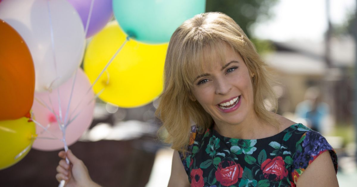 Maria Bamford holding balloons in Lady Dynamite
