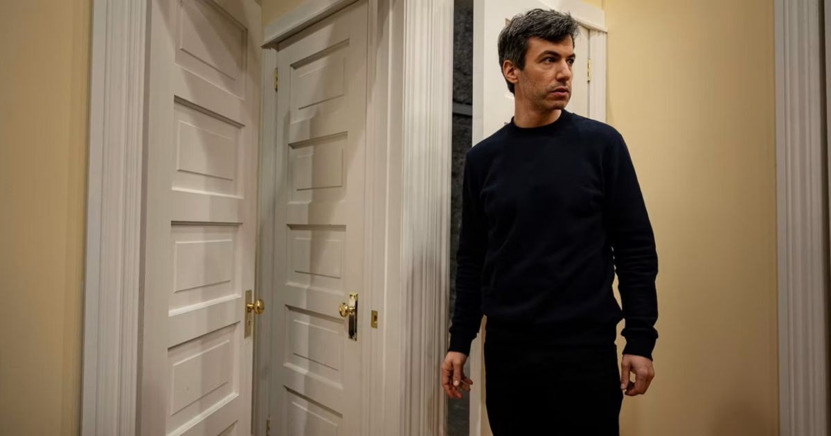 Nathan Fielder next to door city in The Rehearsal