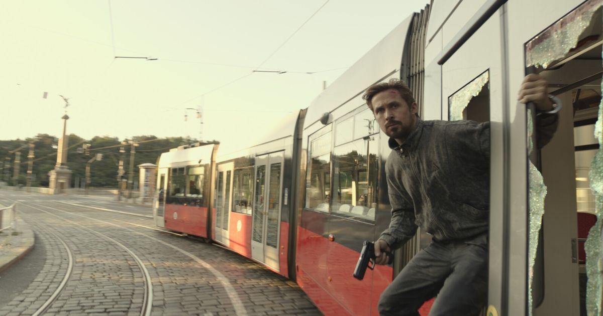 Ryan Gosling riding a train as Sierra Six in The Gray Man