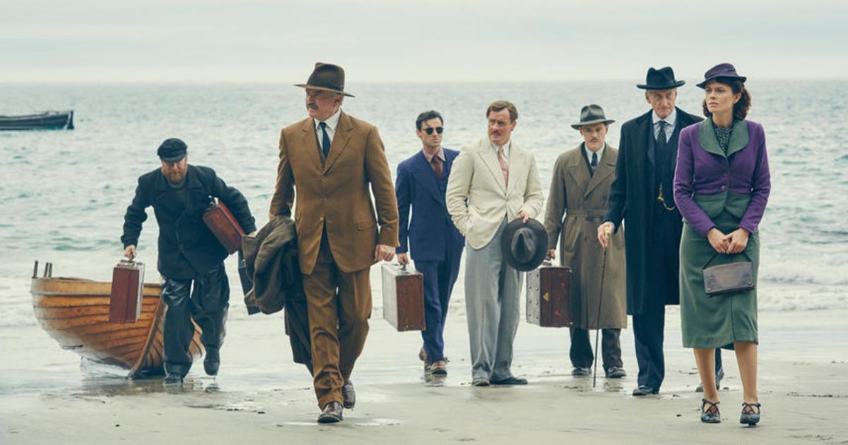 The main cast of And Then There Were None showing up on a beach