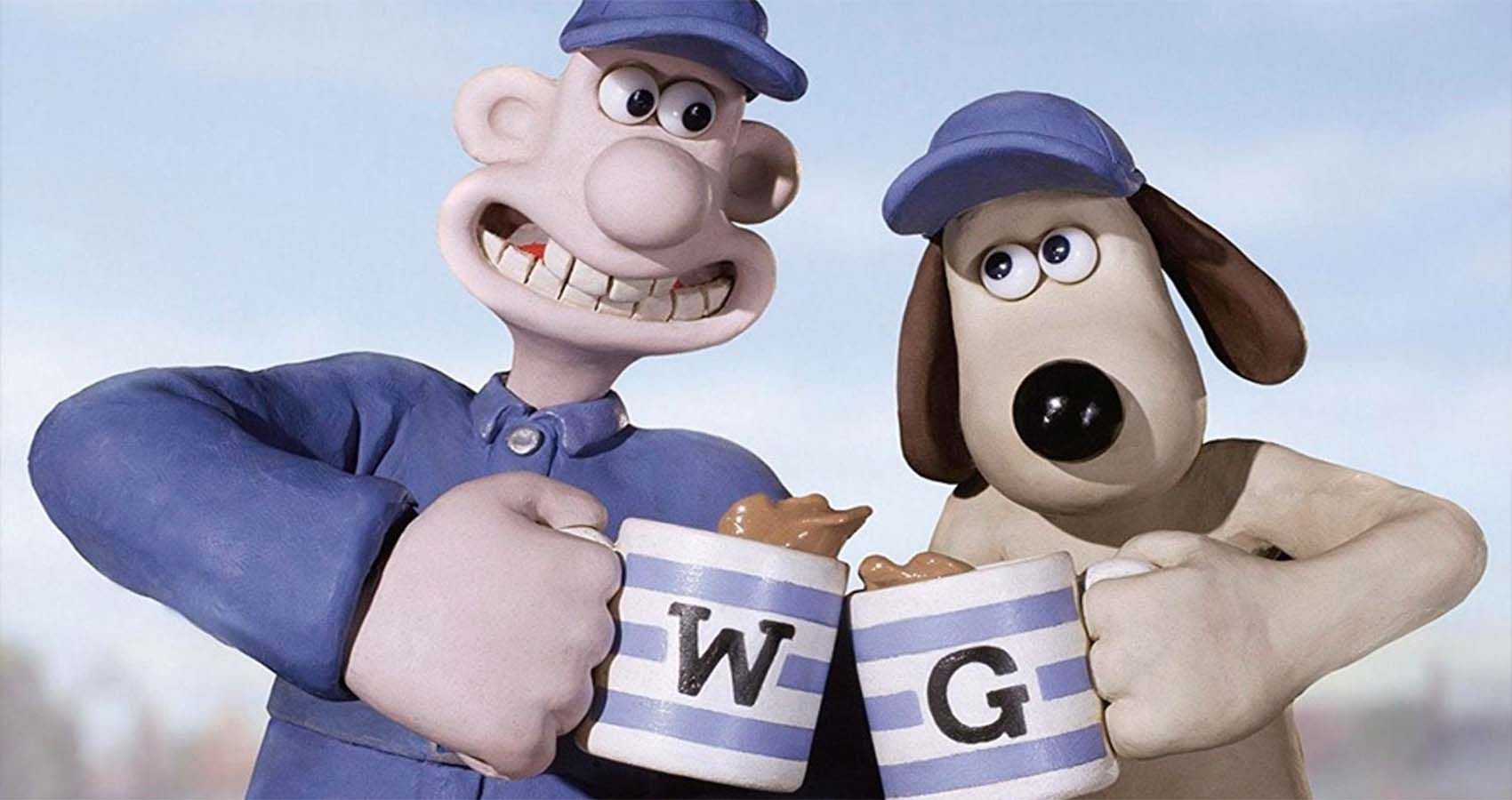 Wallace and Gromit clinking coffee mugs together.