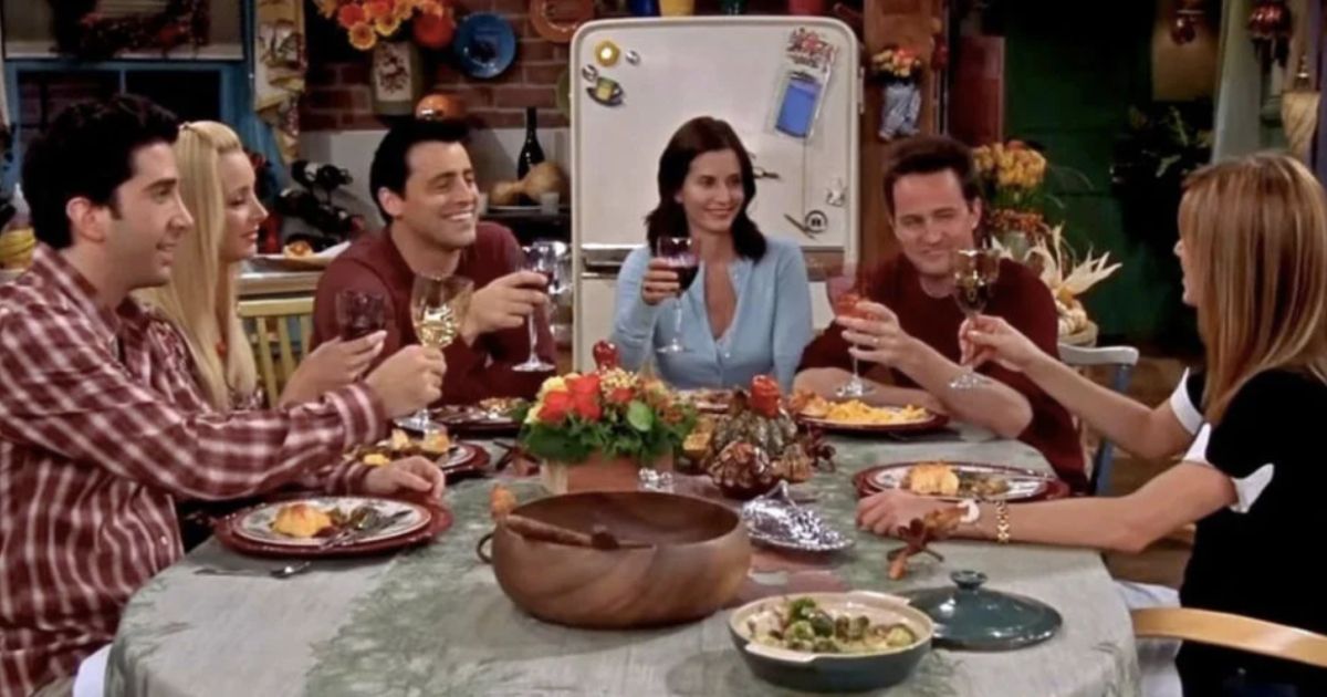 The gang celebrating thanksgiving at Monica and Chandler's apartment in Friends