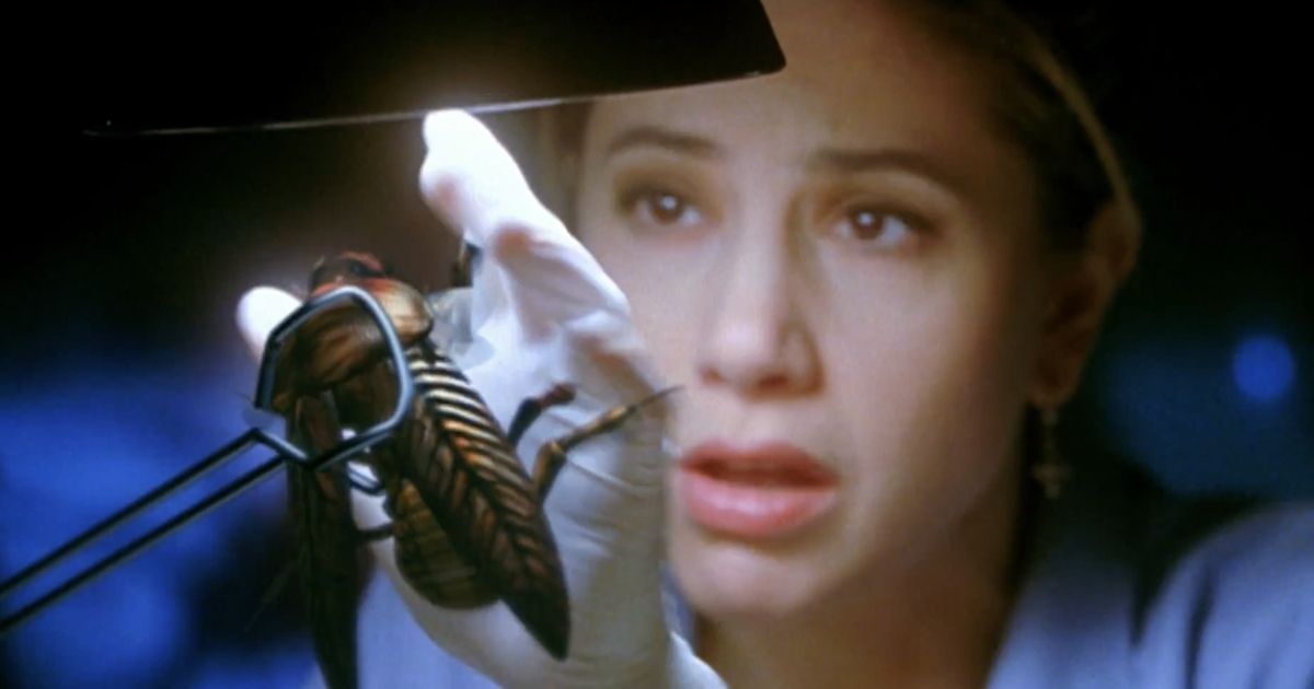 Mira Sorvino with a cockroach