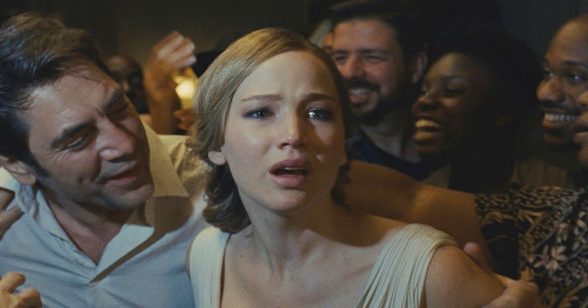 Jennifer Lawrence acts surprised while her husband tries to comfort her in the film mother! (2017)