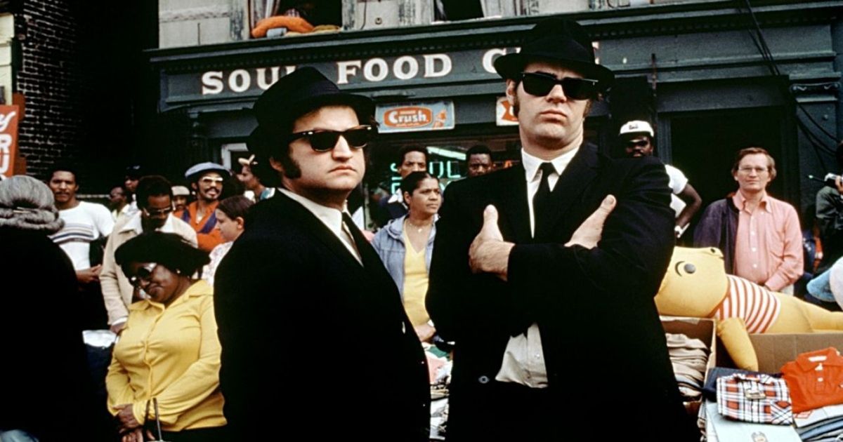 A scene from The Blues Brothers where the two men are looking grim in the city.