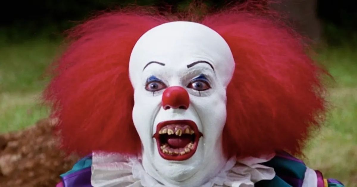 Tim Curry as Pennywise in It 1990