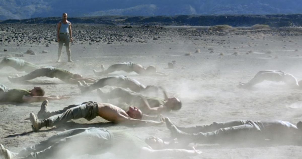 Men on the Sand in Beau Travel by Claire Denis