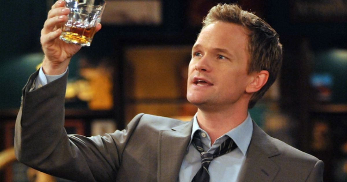 Neil Patrick Harris raising his glass in How I Met Your Mother