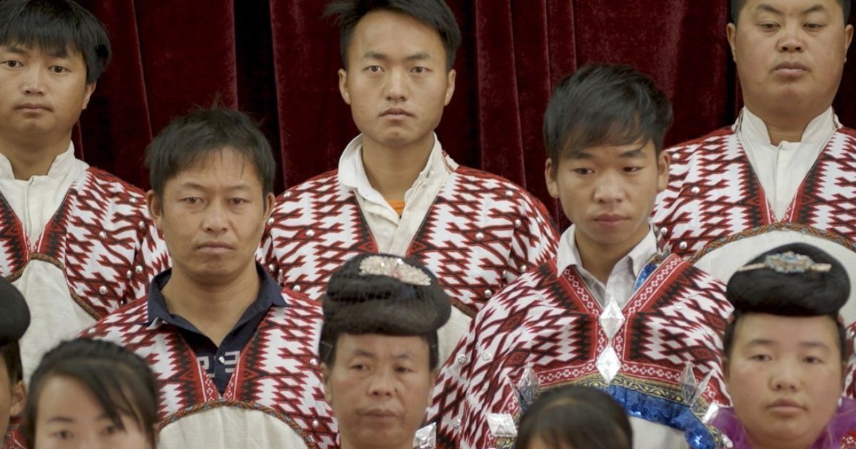 Traditional Chinese Christian choir stands solemnly.