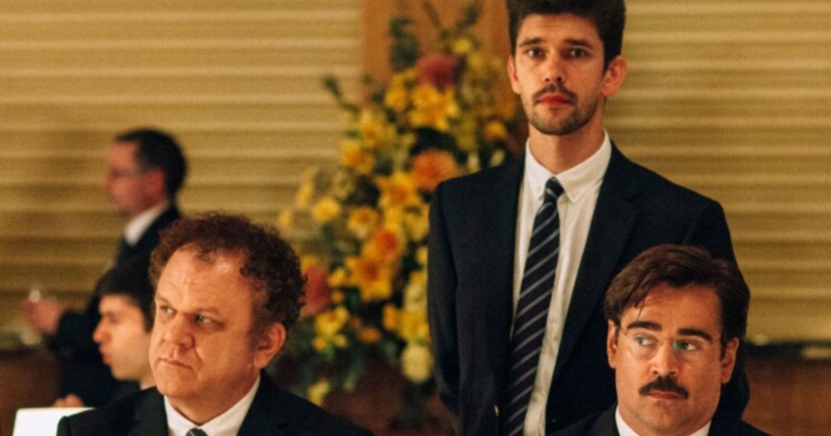 Three men sit at banquet table in The Lobster movie