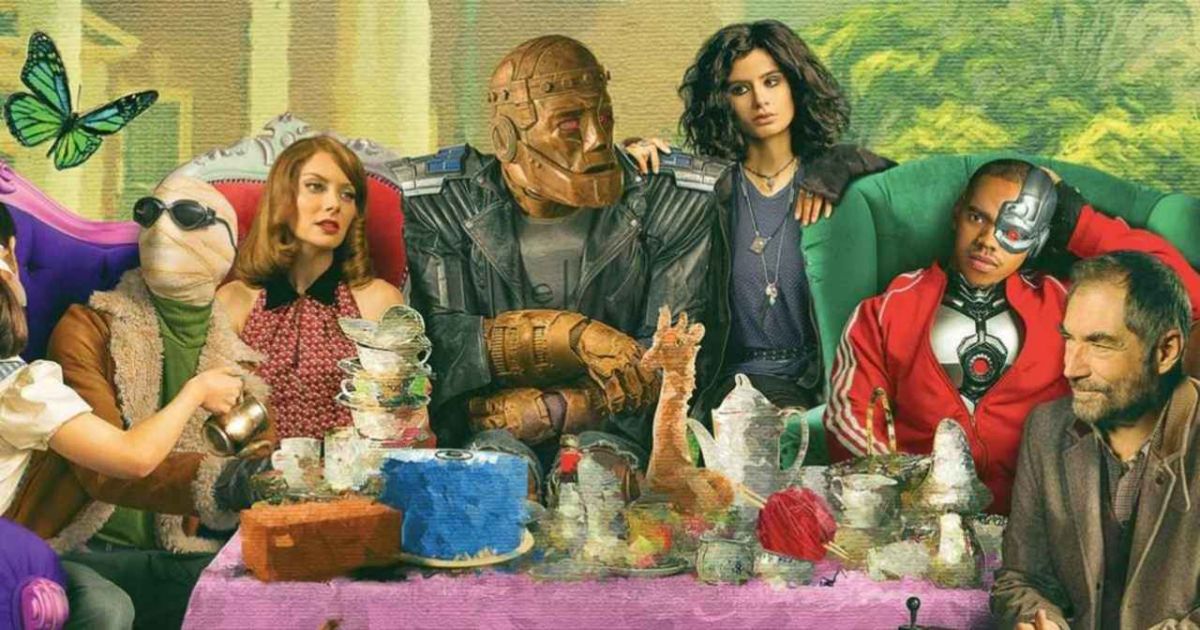 The season 2 cast of HBO Max's Doom Patrol sitting at a banquet table