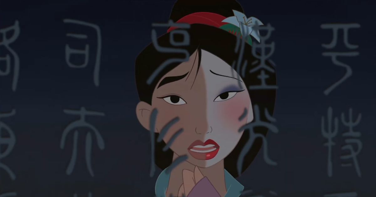 Mulan looks in the mirror