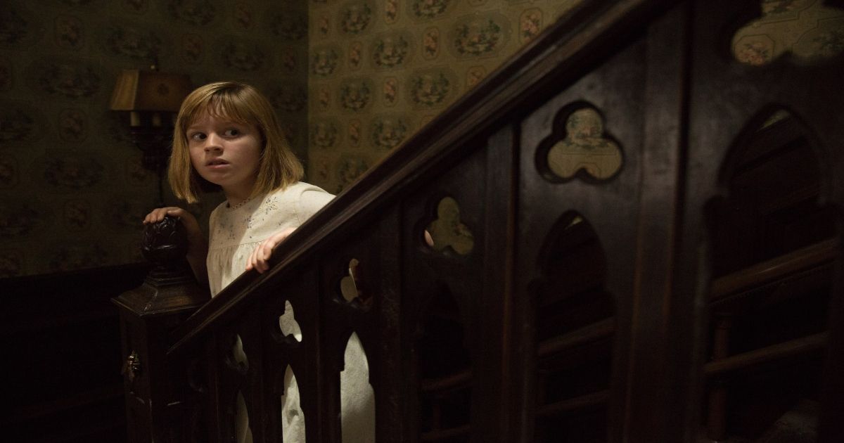 A young girl explores the house in Annabelle: Creation