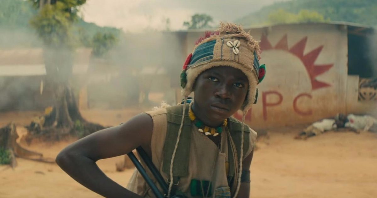 A boy with a gun in his hand in Beasts Of No Nation