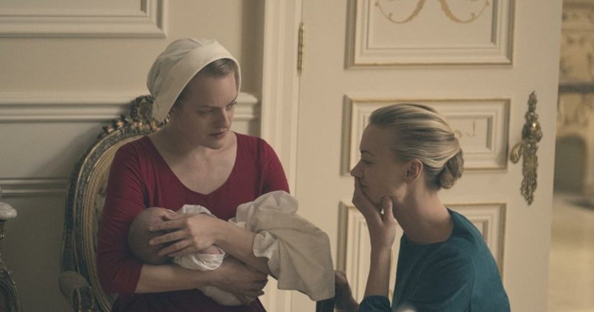 Serena and June holding a baby