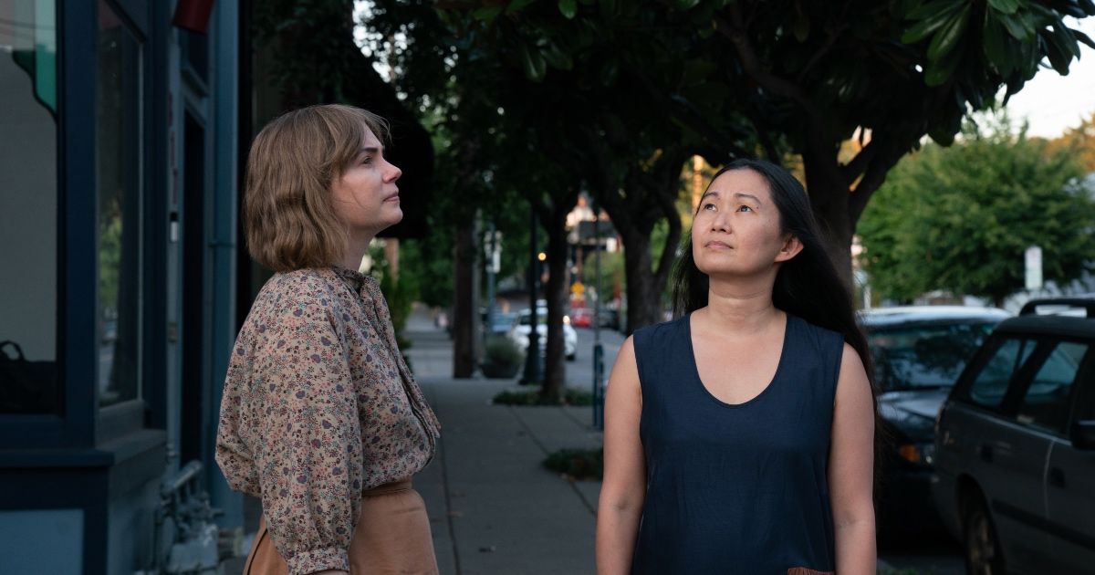 Two women look up at sky in Showing Up