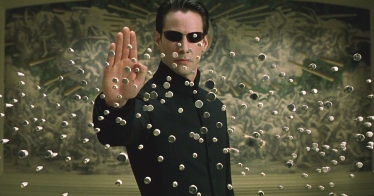 Keanu Reeves stopping bullets in The Matrix