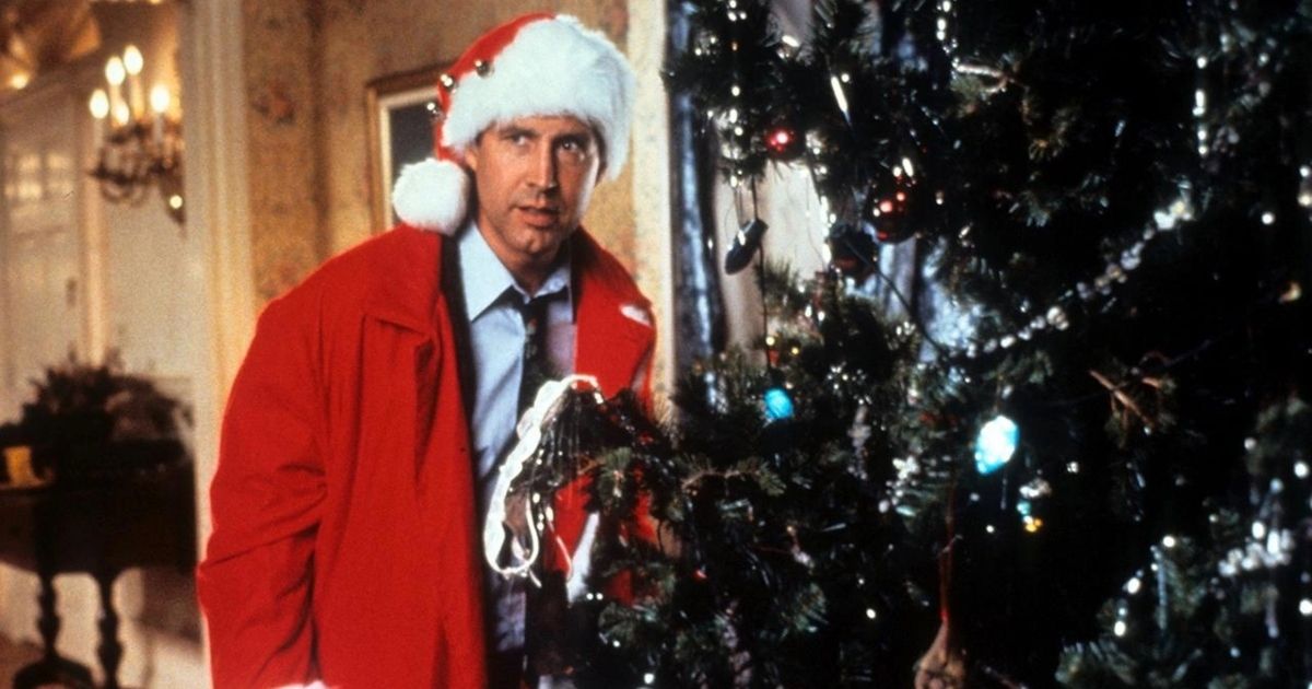 Chevy Chase as Clark Griswold in a santa hat in Christmas Vacation