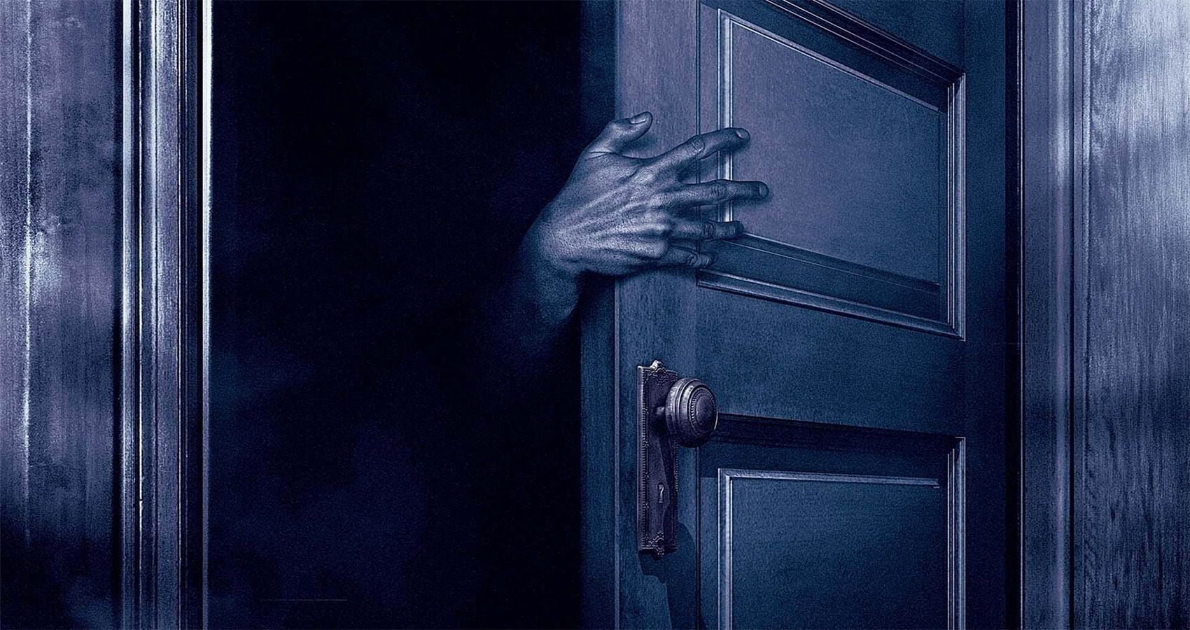 A hand reaching through a closet door in Stephen King's The Boogeyman