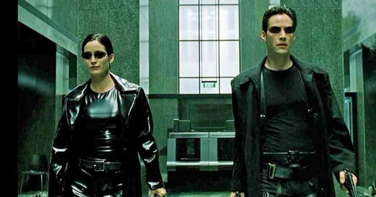 Carrie-Anne Moss as Trinity and Keanu Reeves as Neo