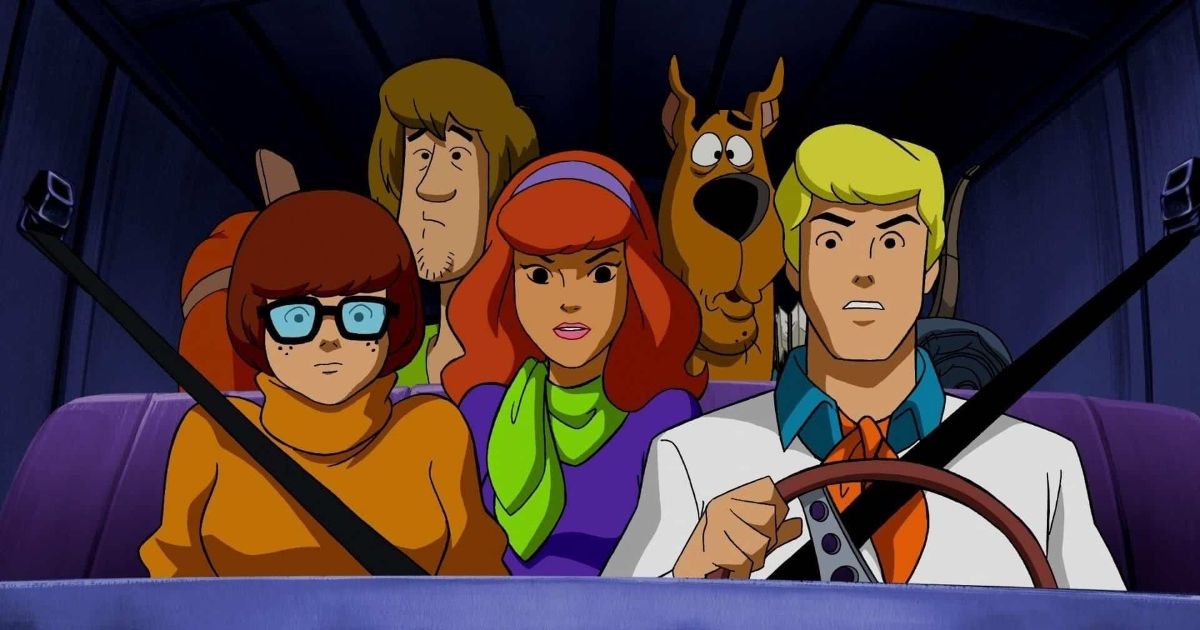 The gang with Fred driving the Mystery Machine