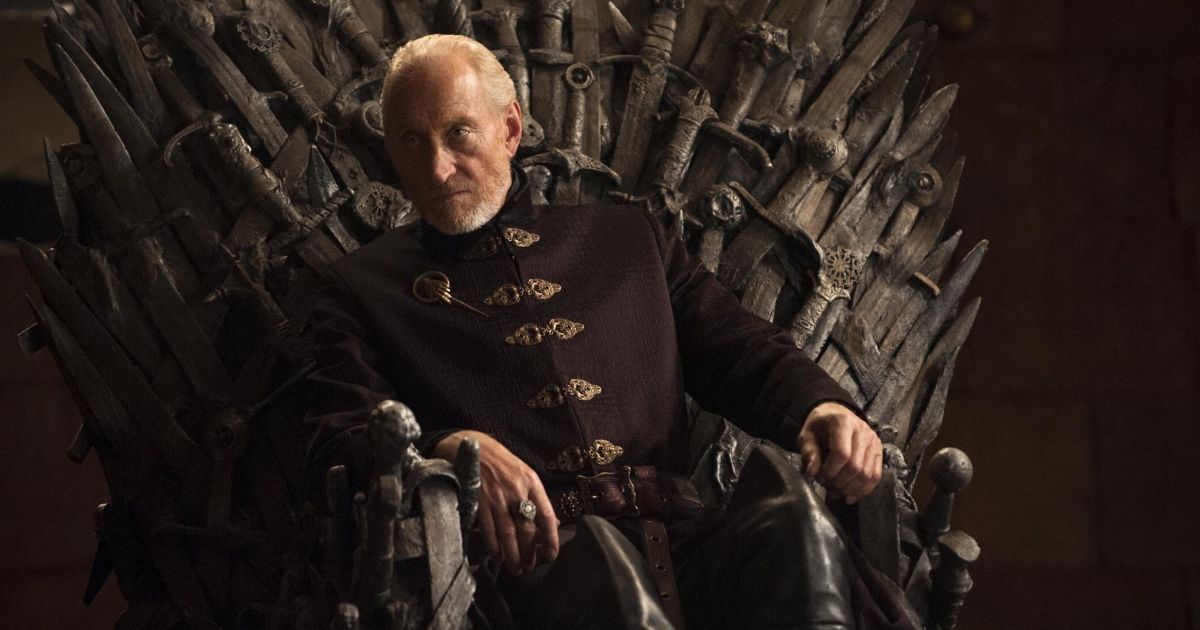 Tywin Lannister sitting on the Iron Throne. 