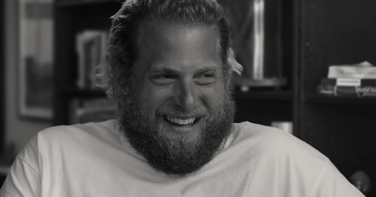 Jonah Hill smiles and laughs.