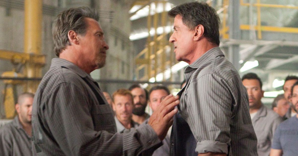 Atnold Schwarzenegger and Sylvester Stallone talk to each other in Escape Plan