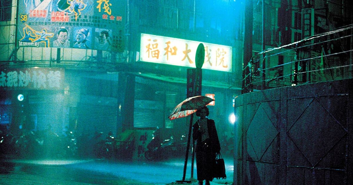 woman walks with umbrella in the rain.