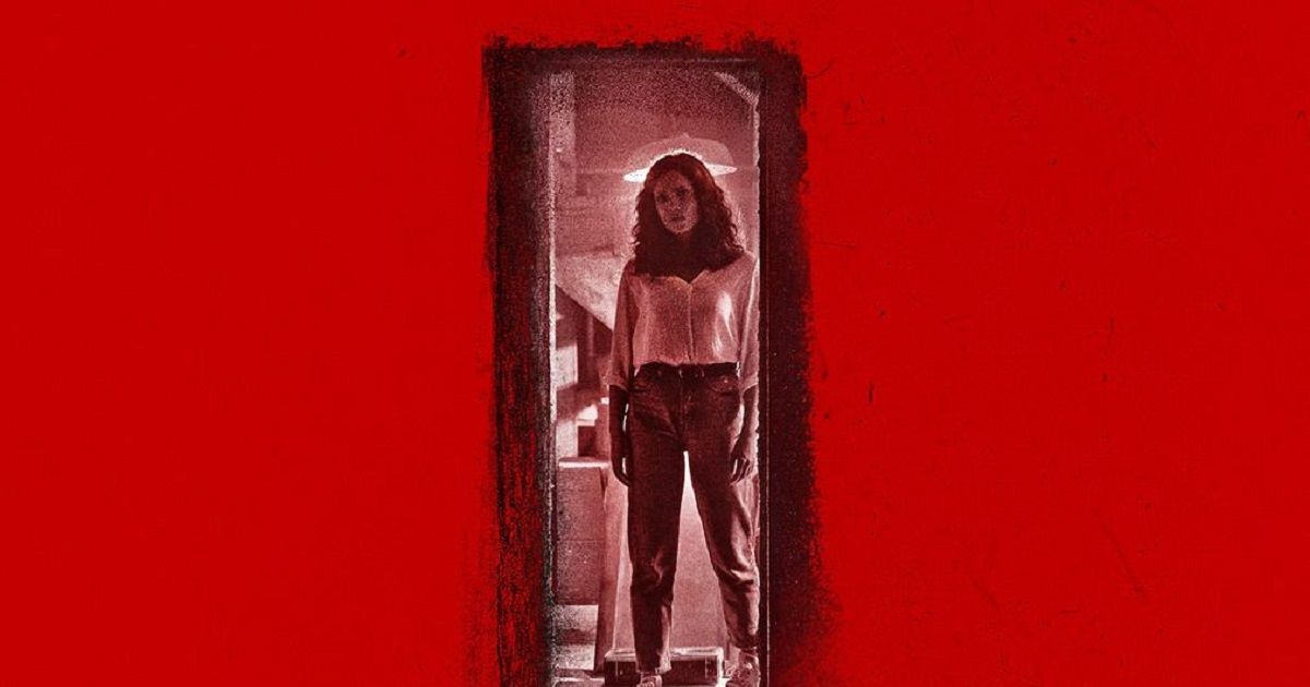 A woman stands at the top of basement stairs in a poster for Barbarian.