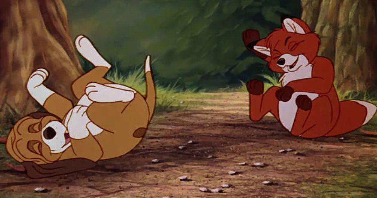 A scene from The Fox and the Hound where the two are rolling around laughing. 